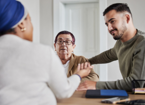Older adults sharing coffee and conversation in a bright community cafe