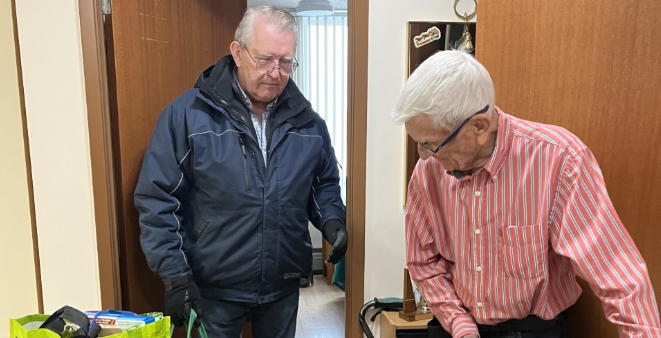 Older adults attending a presentation in a community room