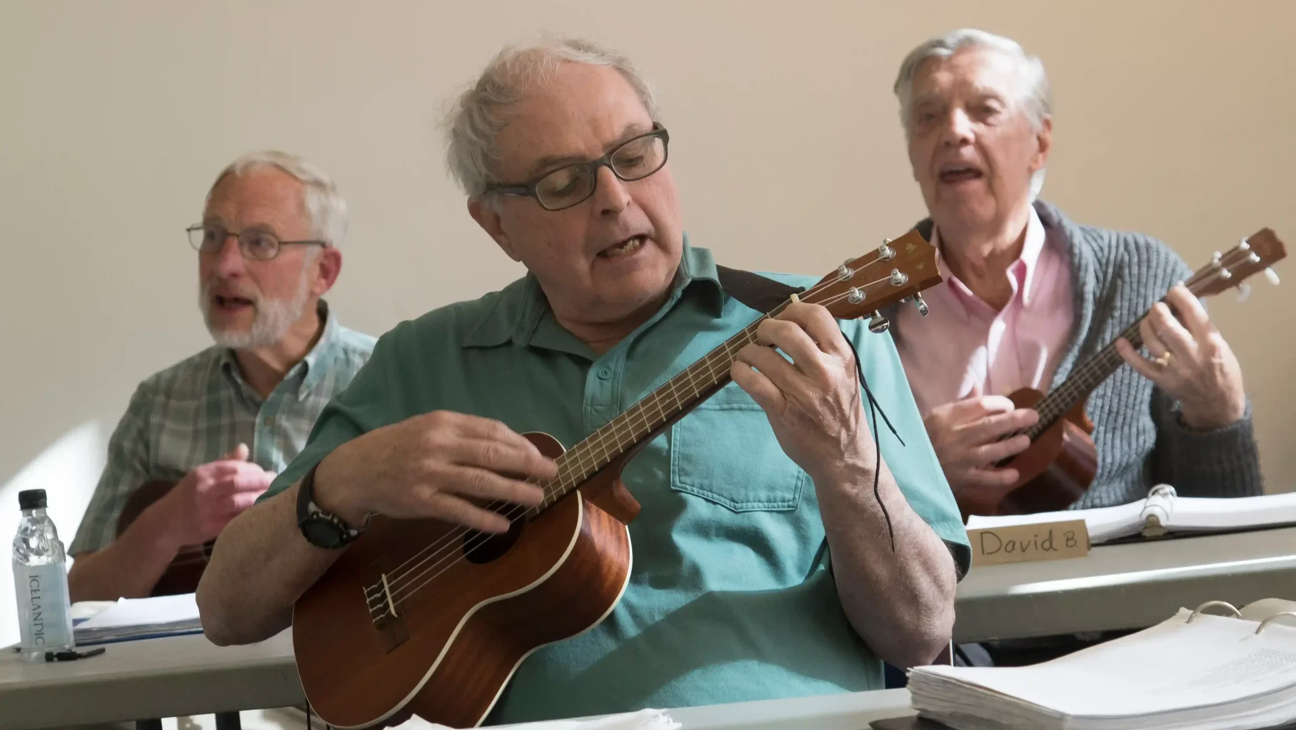 Older adults attending a presentation in a community room