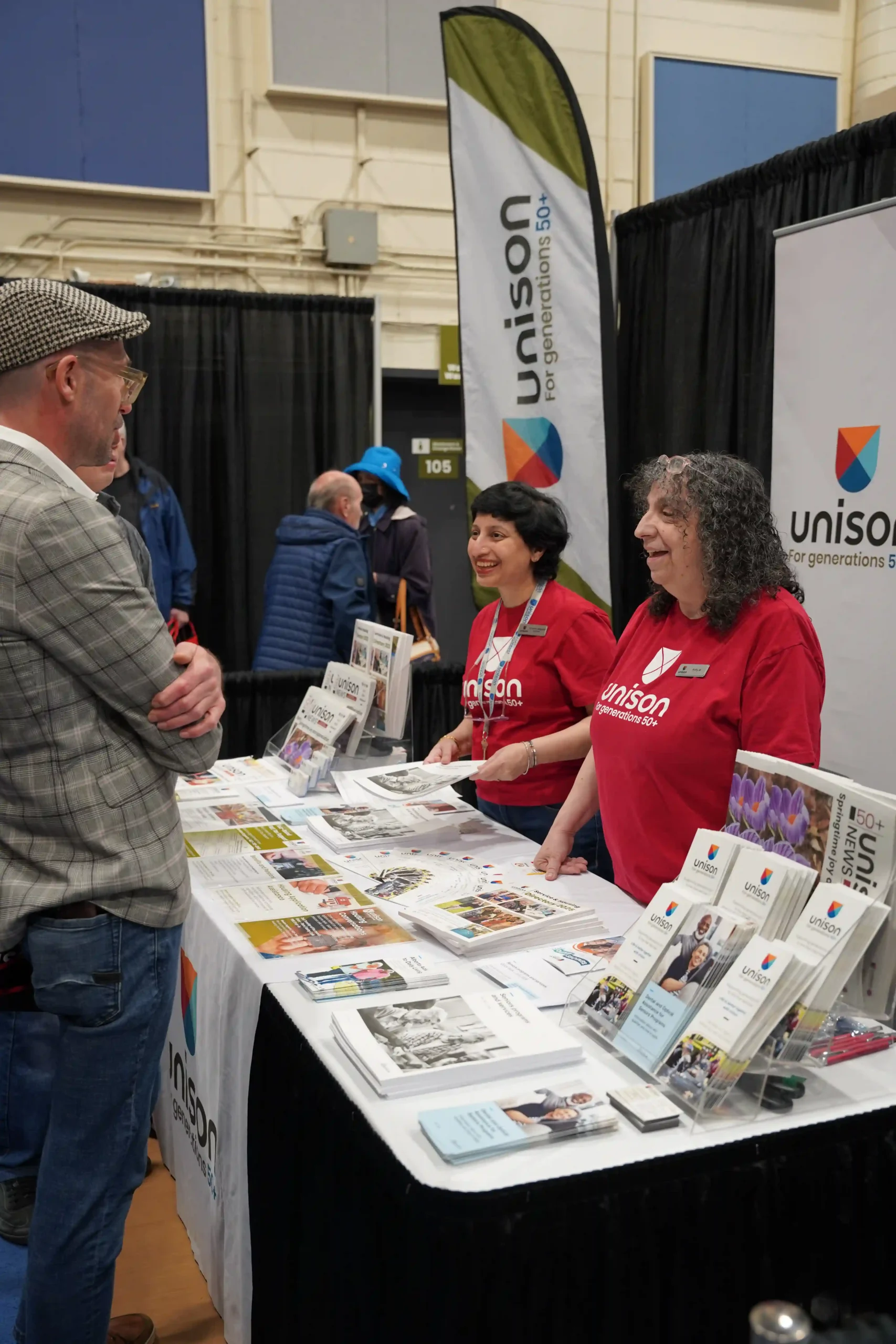 Two older adults reviewing paperwork together at a table